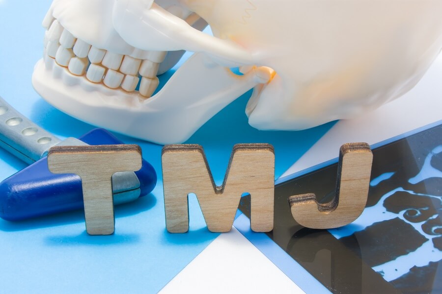 TMJ Disorders: Revealing The Symptoms, Causes, & Treatments